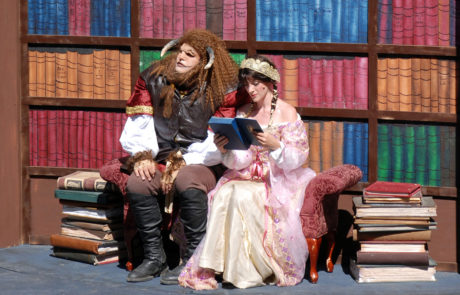 Belle and Beast reading in library