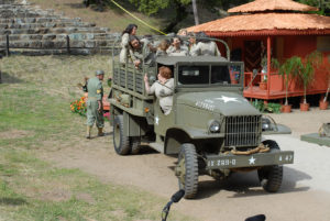 Army truck carrying personnel off the base
