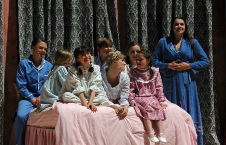 Children with Maria on the bed during the storm