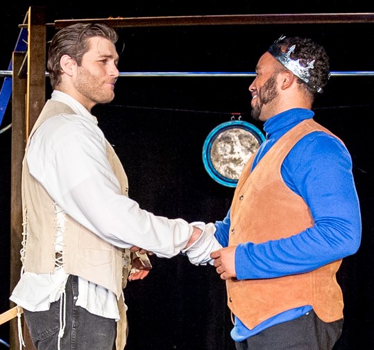 Lancelot (Izaak Heath) and King Arthur (Phillip Harris) shaking hands